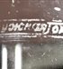 The manufacturer's stamp on the side wall.